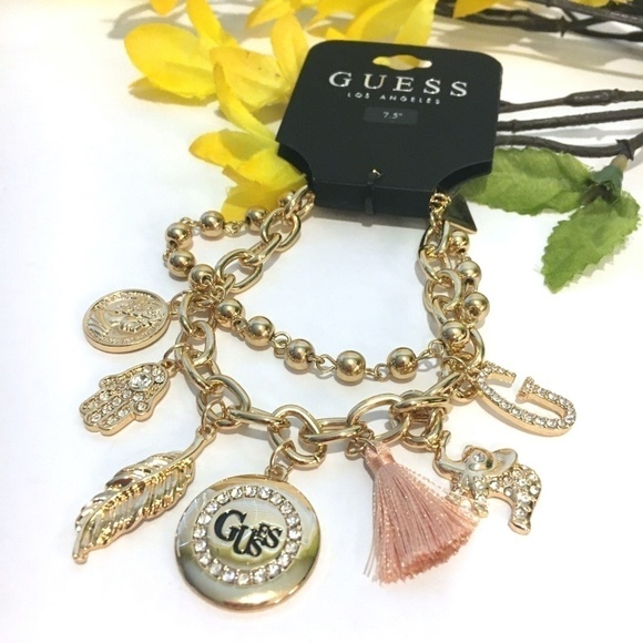 3/$29! GUESS Charm Bracelet Tassel, Elephant, Leaf - Picture 1 of 7